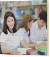 Asian Student Lady Smile And Read A Book In Library In Universit Wood Print
