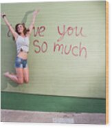 Attractive Austin Local Woman Jumps For Joy At The I Love You So Much Mural Wood Print