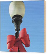 Lamp Post With Red Bow Wood Print