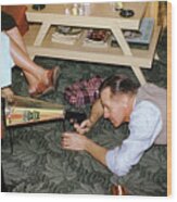 Man Playing With Chritmas Toys Wood Print