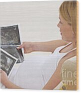 Pregnant Woman Looks At Ultrasonounds Wood Print