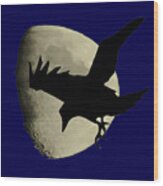 Raven Flying Across The Moon Wood Print