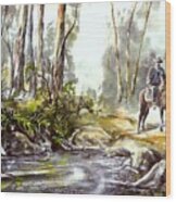 Rider By The Creek Wood Print