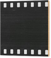 Strip Of Old Celluloid Film With Dust And Scratches Wood Print