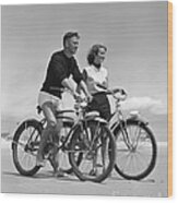 Teen Boy And Girl Biking At The Beach Wood Print