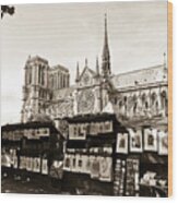 The Bouquinistes And Notre-dame Cathedral Wood Print