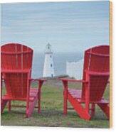 Two Red Adirondack Chairs Looking Out To A Lighthouse Wood Print