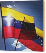 Venezuelan Flags Against The Sun Wood Print