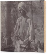 Young Man In White Robe And Head Gear Holding Scabbard Wood Print