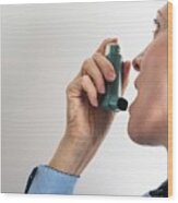Close-up Of Woman Using An Asthma Inhaler #1 Wood Print