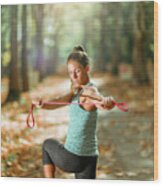 Woman Exercising With Elastic Band Outdoors #6 Wood Print