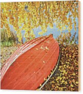 A Boat Covered With Autumn Leaves Wood Print