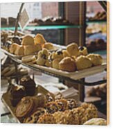 Assorted Pastries On Display In A Cafe Wood Print