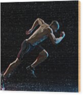 Athlete Runner Running Through Rain Wood Print