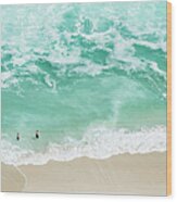 Bathers Swimming On Isolated Beach Wood Print