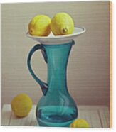 Blue Pitcher With Lemons On White Plate Wood Print