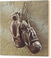 Boxing Gloves Hung Up On Wall Wood Print