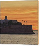 Candelaria Fortress Silhouette At Sunset Against Orange Sky Wood Print