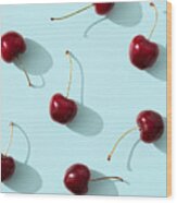 Cherries On Turquoise Background Wood Print