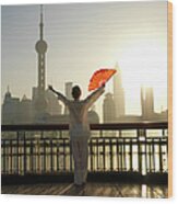Chinese Woman Fan Dancing In Front Of Wood Print