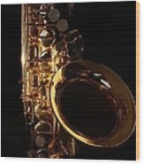 Close-up Of A Golden Saxophone On A Wood Print