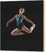 Dancer Jumping On Black Background Wood Print