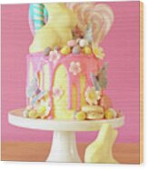 Easter Candy Land Drip Cake Decorated With Lollipops And White Bunny. Wood Print