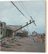 Family Passing Cyclone Damaged Wood Print