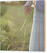 Female Hand Holding Grass In Wood Print
