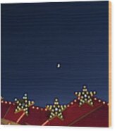 Flat Background Of Blue Sky With Small Moon And Luminous Light Bulbs. Wood Print