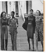 Four Models On A Bridge Wearing Diane Von Wood Print