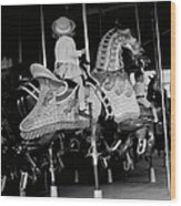 Girl Riding A Carousel Wood Print