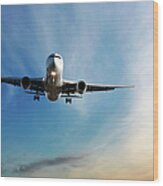 Jet Airplane Landing At Dusk Wood Print