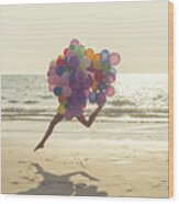 Jumping Girl With Balloons Wood Print