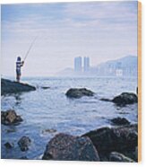 Man Fishing In Victoria Harbour Wood Print
