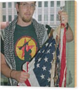 Man Holding Burned American Flag Wood Print