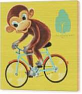 Monkey Riding Bicycle Wood Print