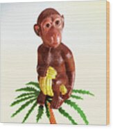 Monkey Sitting On Palm Tree With Bananas Wood Print