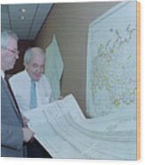 Officials Reviewing Geological Charts Wood Print