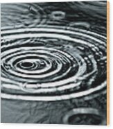 Raindrops Fall Into A Puddle During An Wood Print