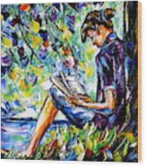 Reading By The River Wood Print