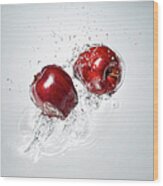 Red Apple Splashing In To Water Wood Print