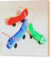 Red, Blue And Green Helicopters Wood Print