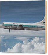 Republic Airlines Convair Cv-580 Among The Clouds Wood Print