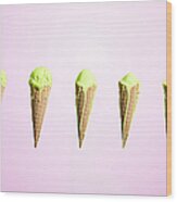 Row Of Melting Ice Creams At Different Wood Print