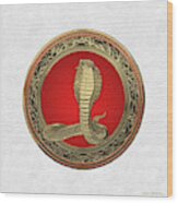 Sacred Gold King Cobra On White Leather Wood Print
