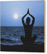 Silhouette Of Young Woman Doing Yoga Wood Print