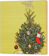 Small Christmas Tree Against Yellow Wood Print