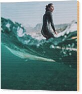 Split Image Of Female Surfer Surfing A Small Wave Wood Print