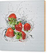 Strawberries Splashing In To Water Wood Print